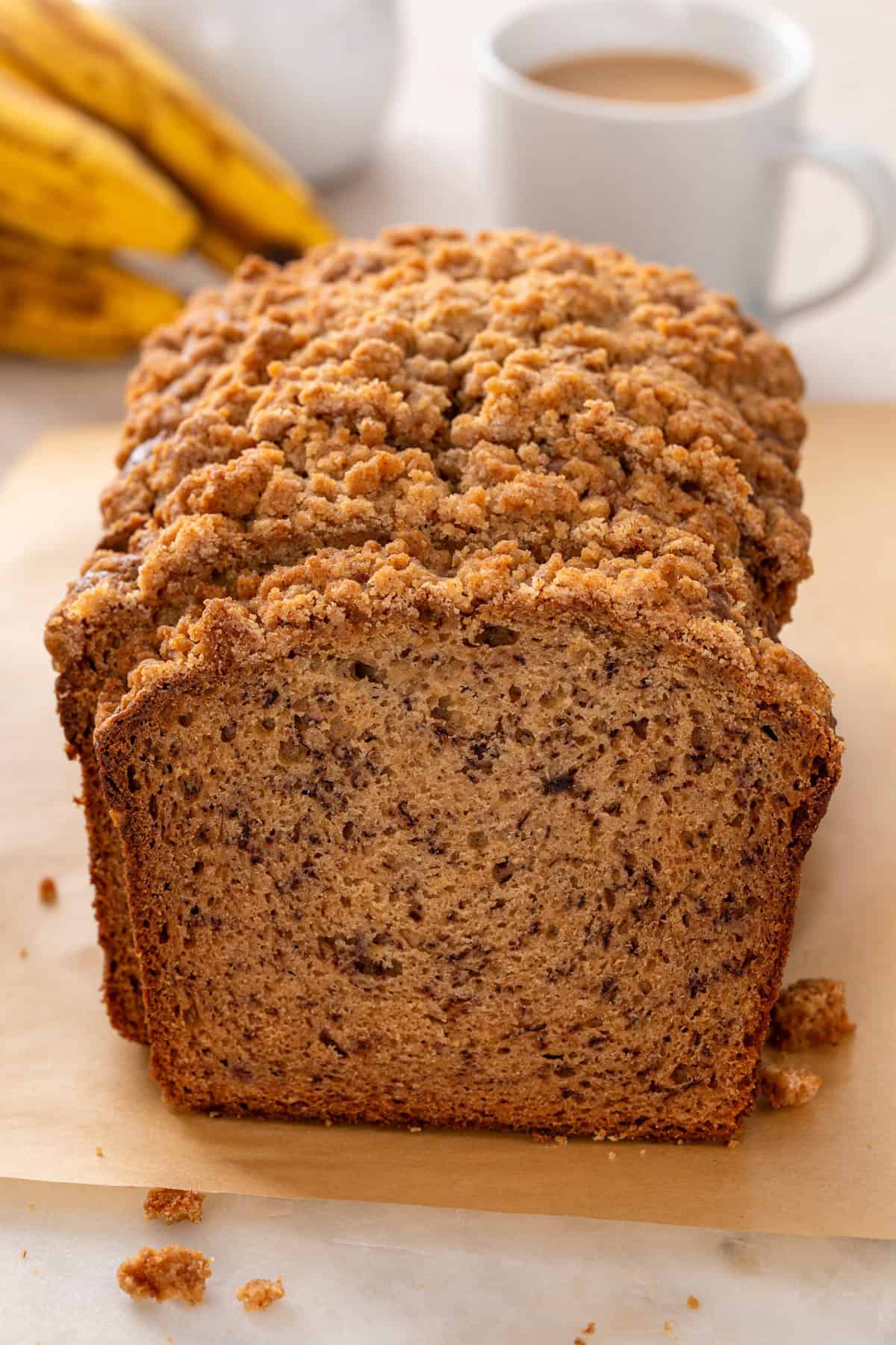 Cross-section view of a sliced loaf of sour cream banana bread.