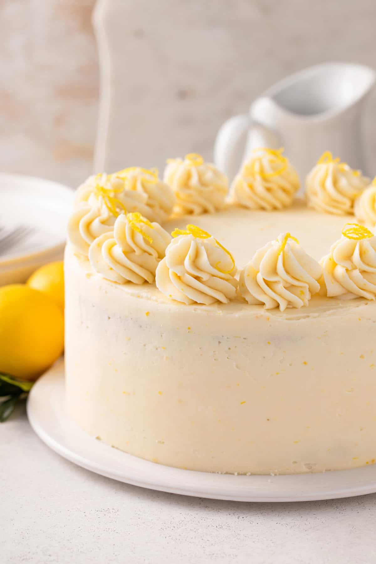 Layer cake covered in lemon buttercream frosting.