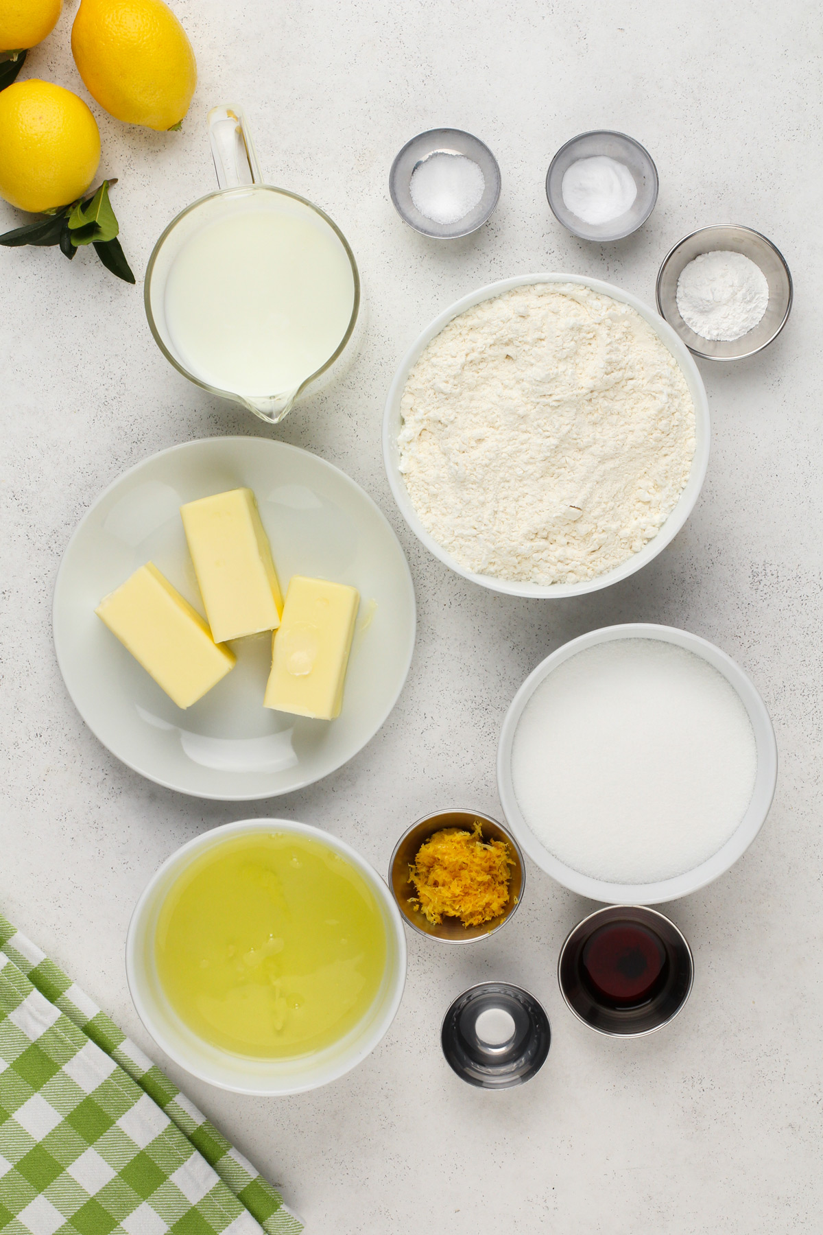 Lemon cake ingredients arranged on a countertop.