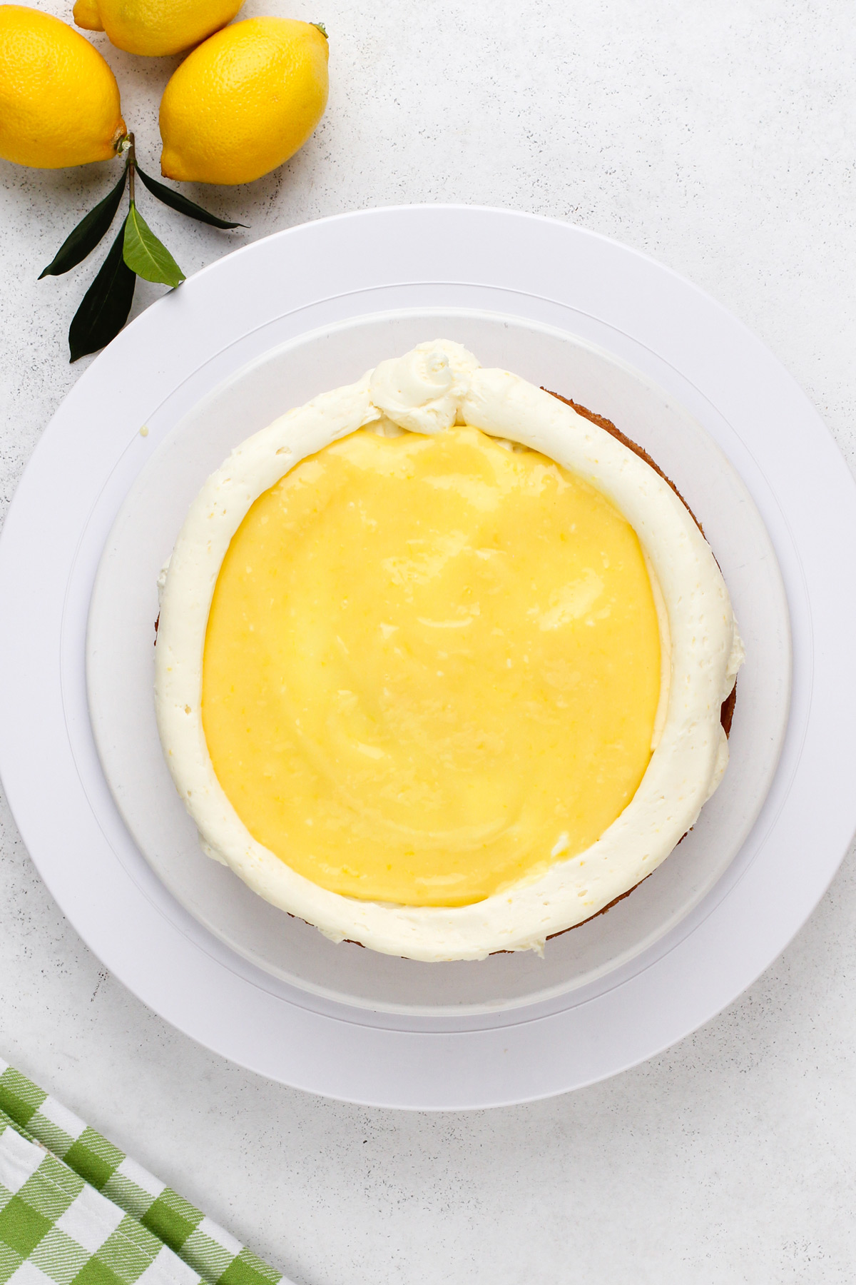 Lemon curd spread on top of a cake layer.