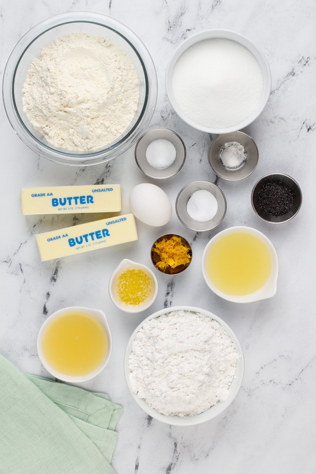 Lemon poppy seed cookie ingredients arranged on a countertop.